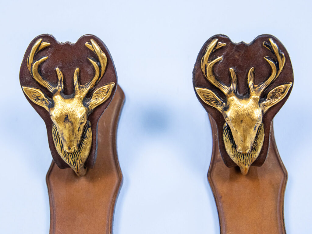 Настінні тримачі/вішаки для зброї